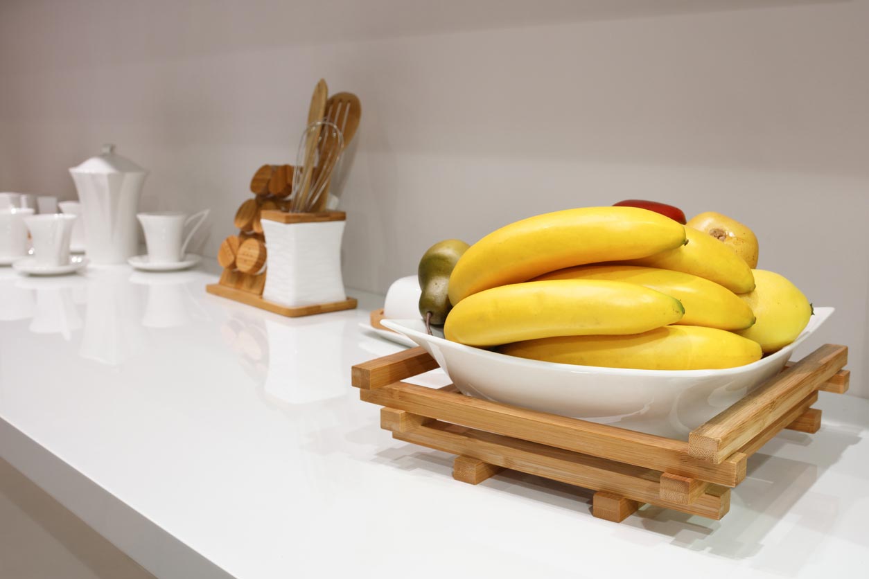 bananas in bowl on kitchen counter