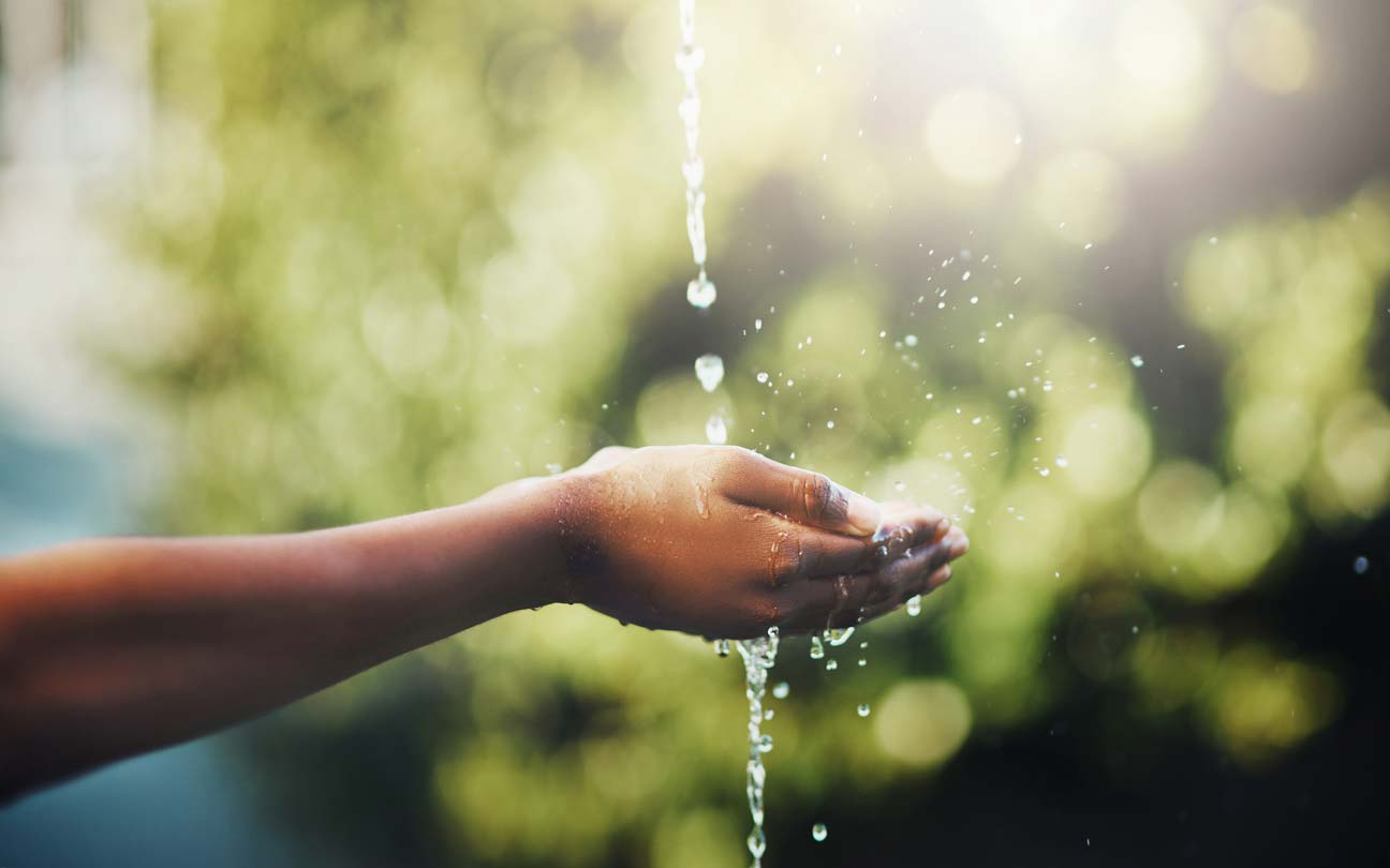 hands held out catching water