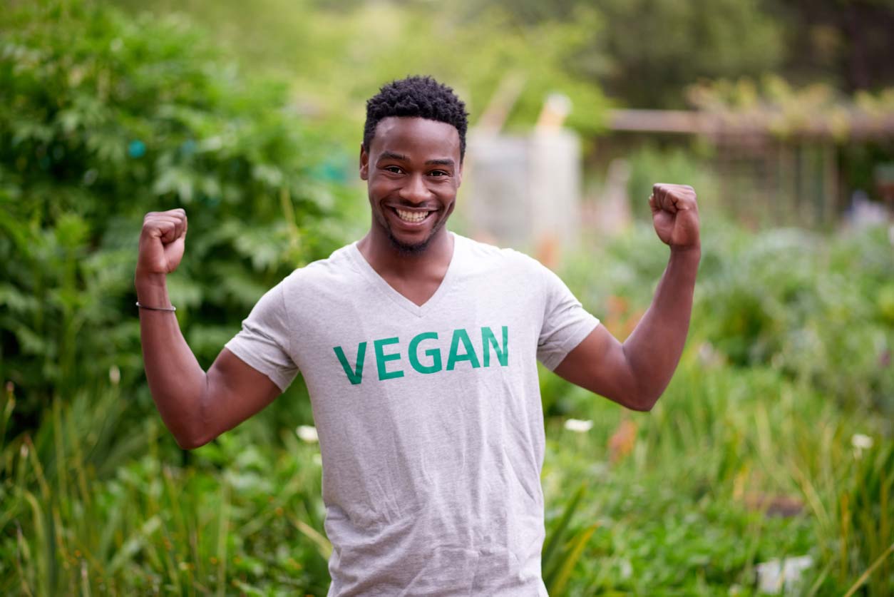 man of color wearing tshirt with word vegan