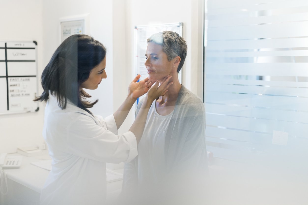 Doctor examining female patient fat hospital