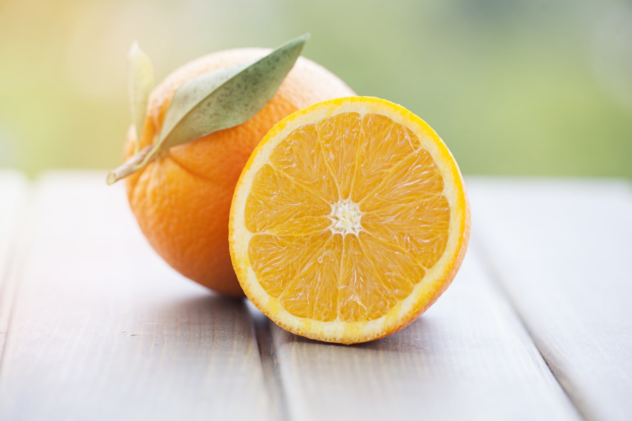 Orange isolated on wood background