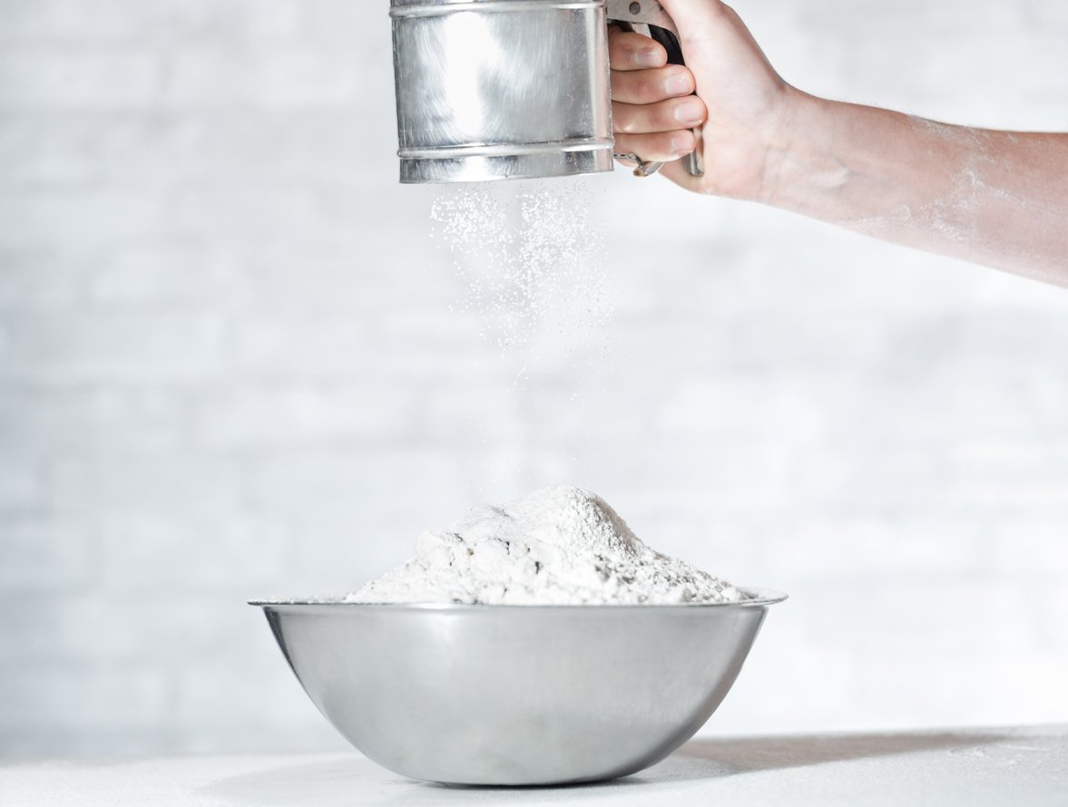 A stock photo of sifting flour