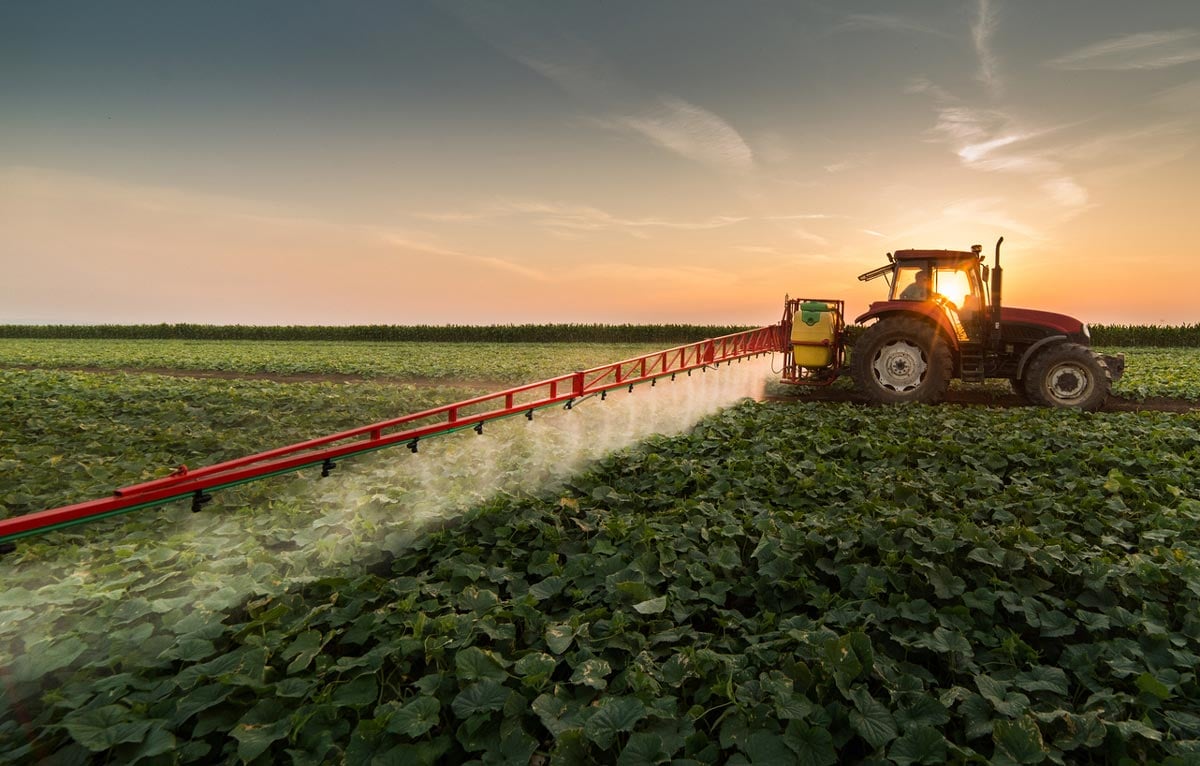 tractor spraying field