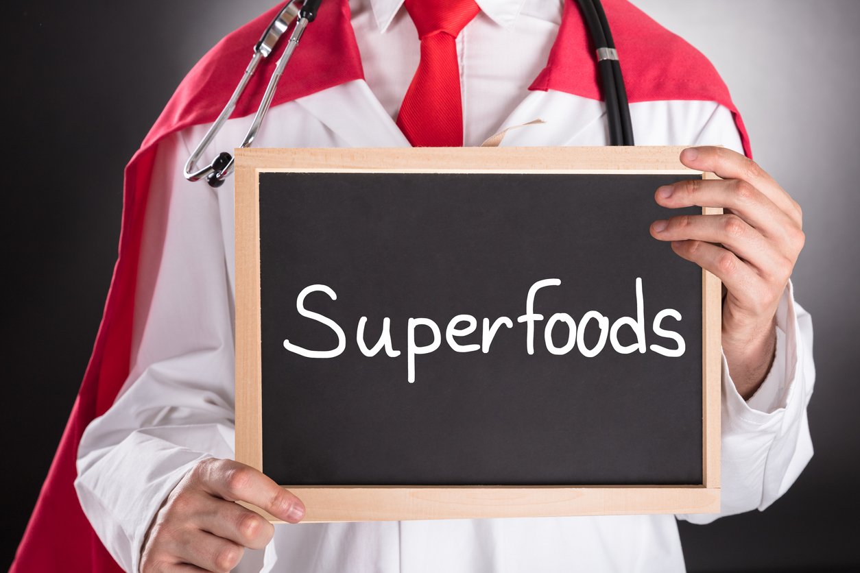 Superhero Doctor Holding Small Chalkboard