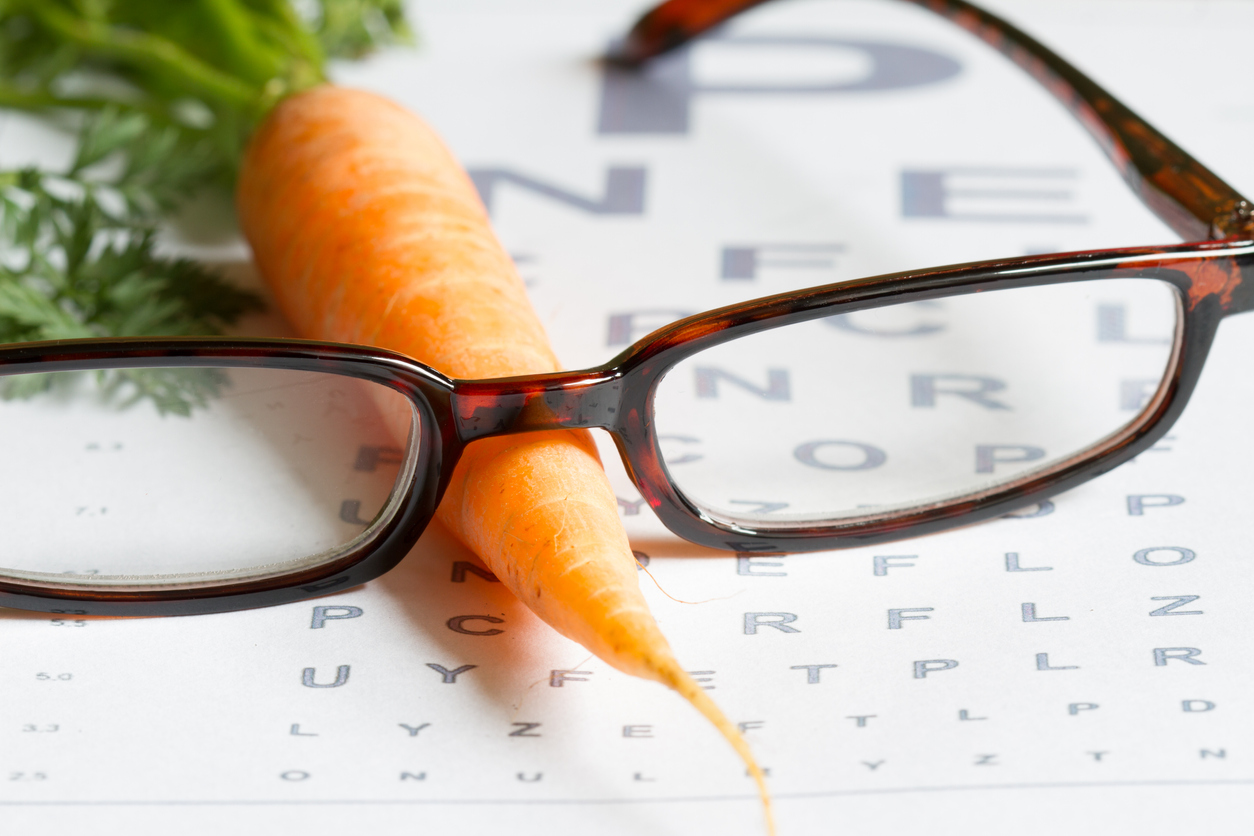 Carrot vitamin A and eye test chart healt medical concept