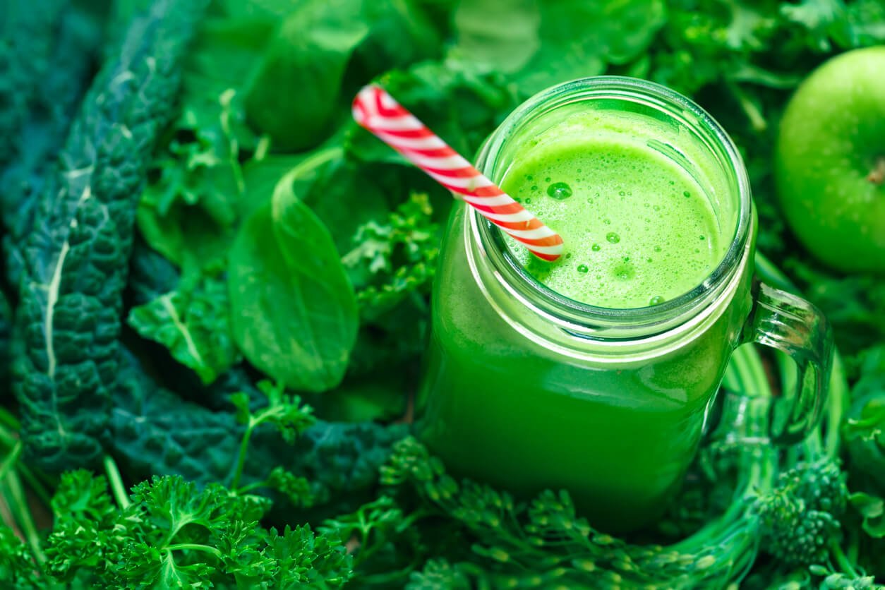 organic green juice with drinking straw