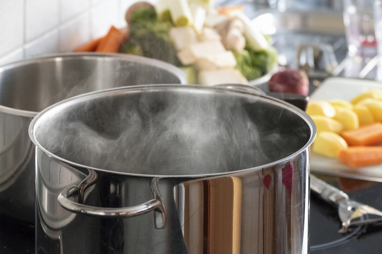 Blanching vegetables in big cooking pot preparation