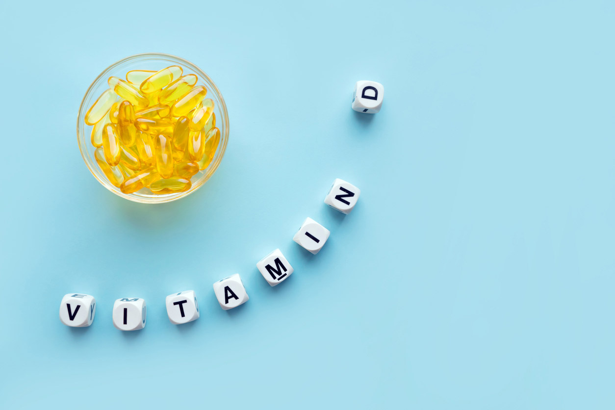 vitamin d spelled out with capsules