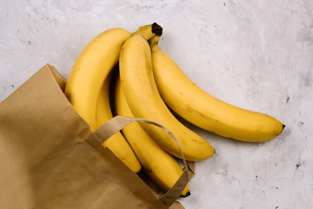 fresh bananas in paper bag