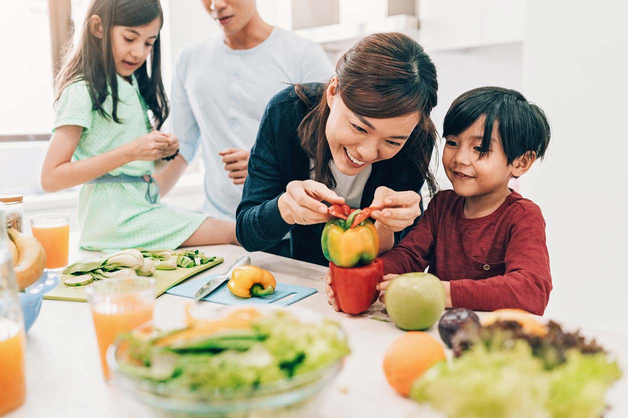 family preparing healthy salad together