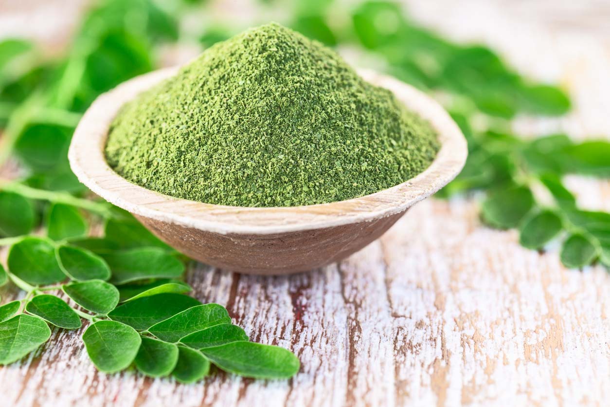 moringa powder in coconut bowl