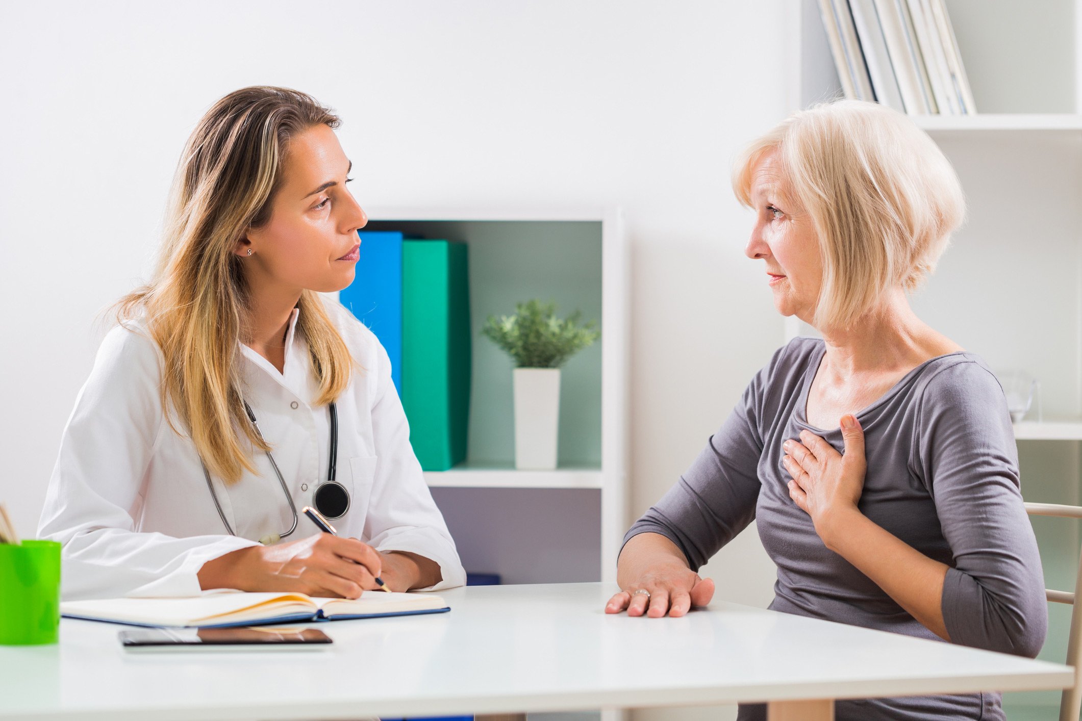 A woman talking to a doctor about her heart