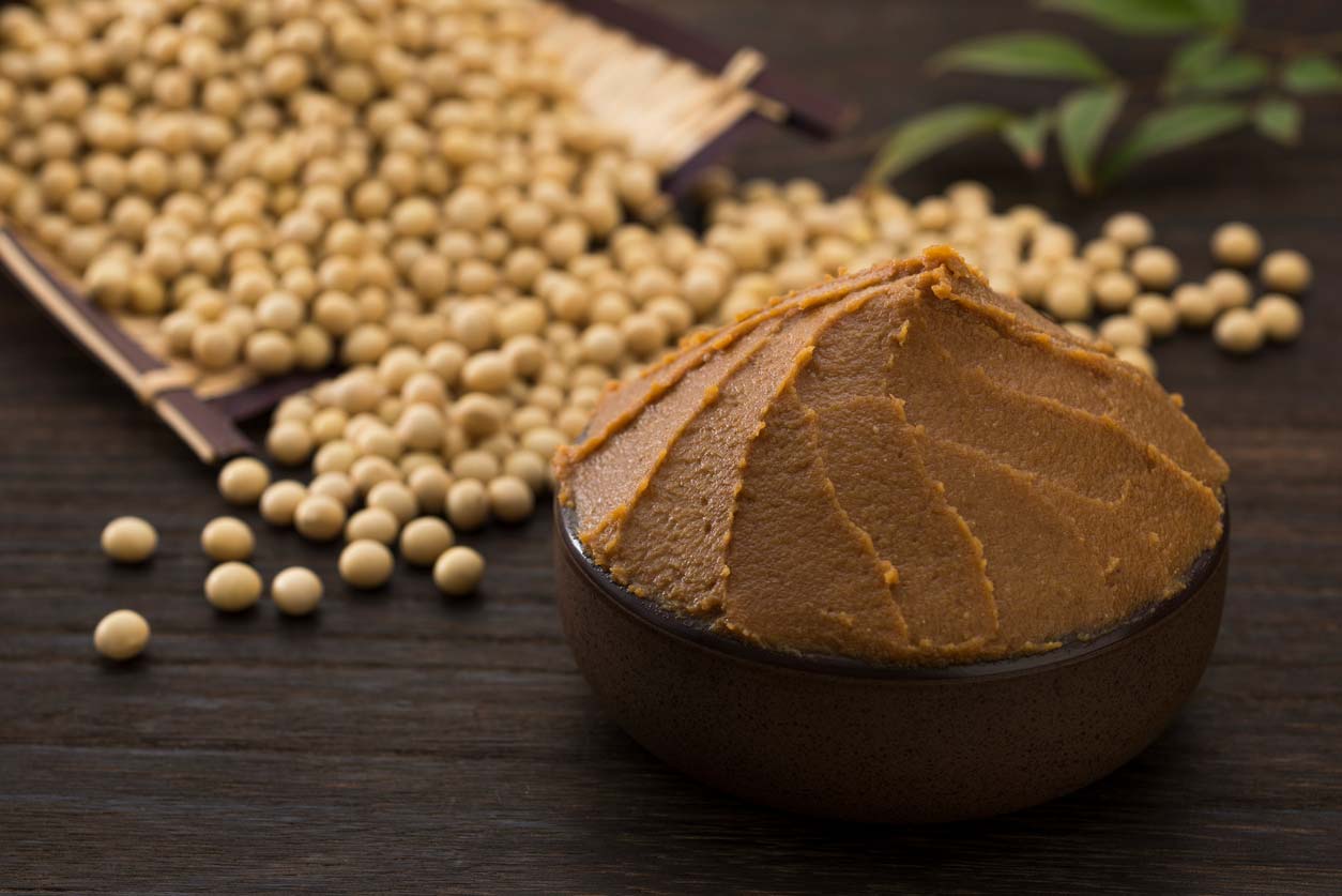 miso in bowl and soybeans on table