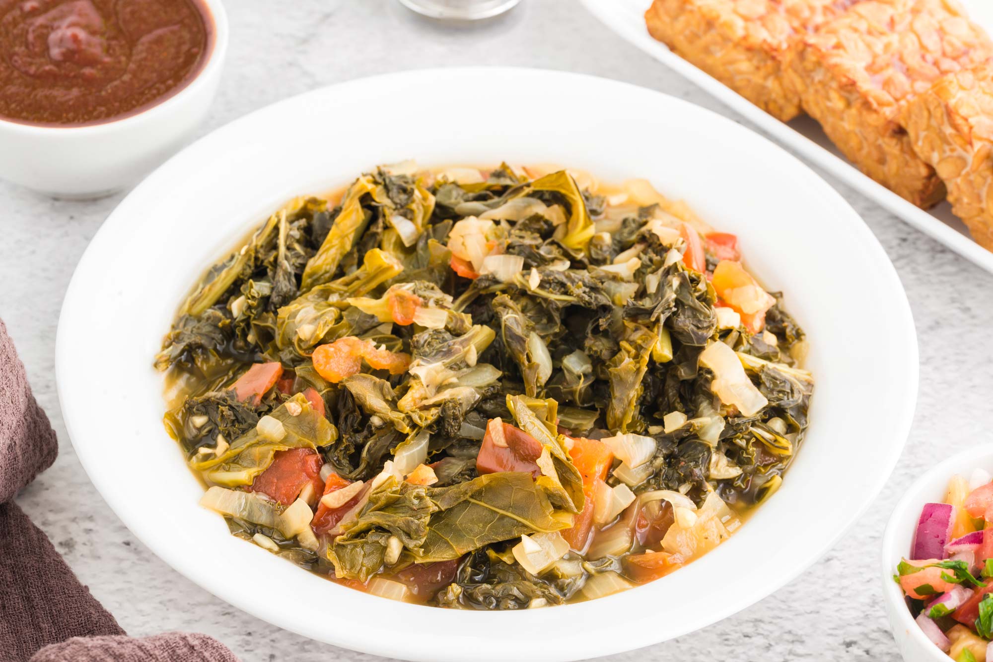 lemony braised kale and tomatoes in bowl