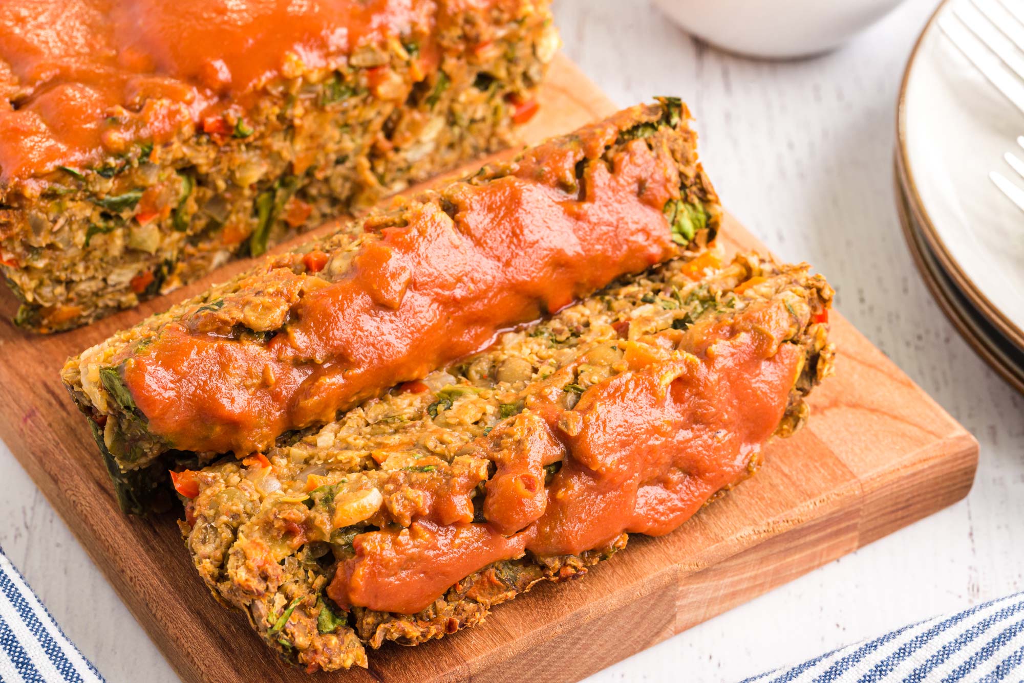 lentil flax loaf slices on cutting board