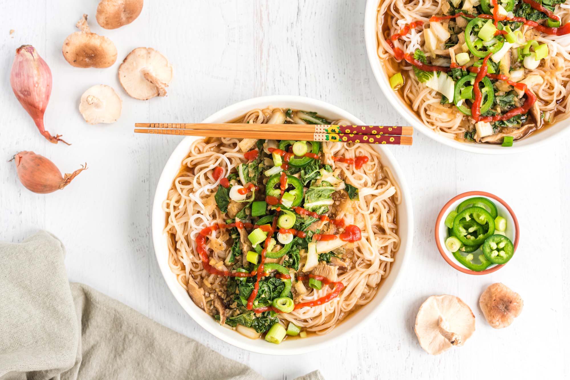 miso shiitake and bok choy soup with noodles in bowls