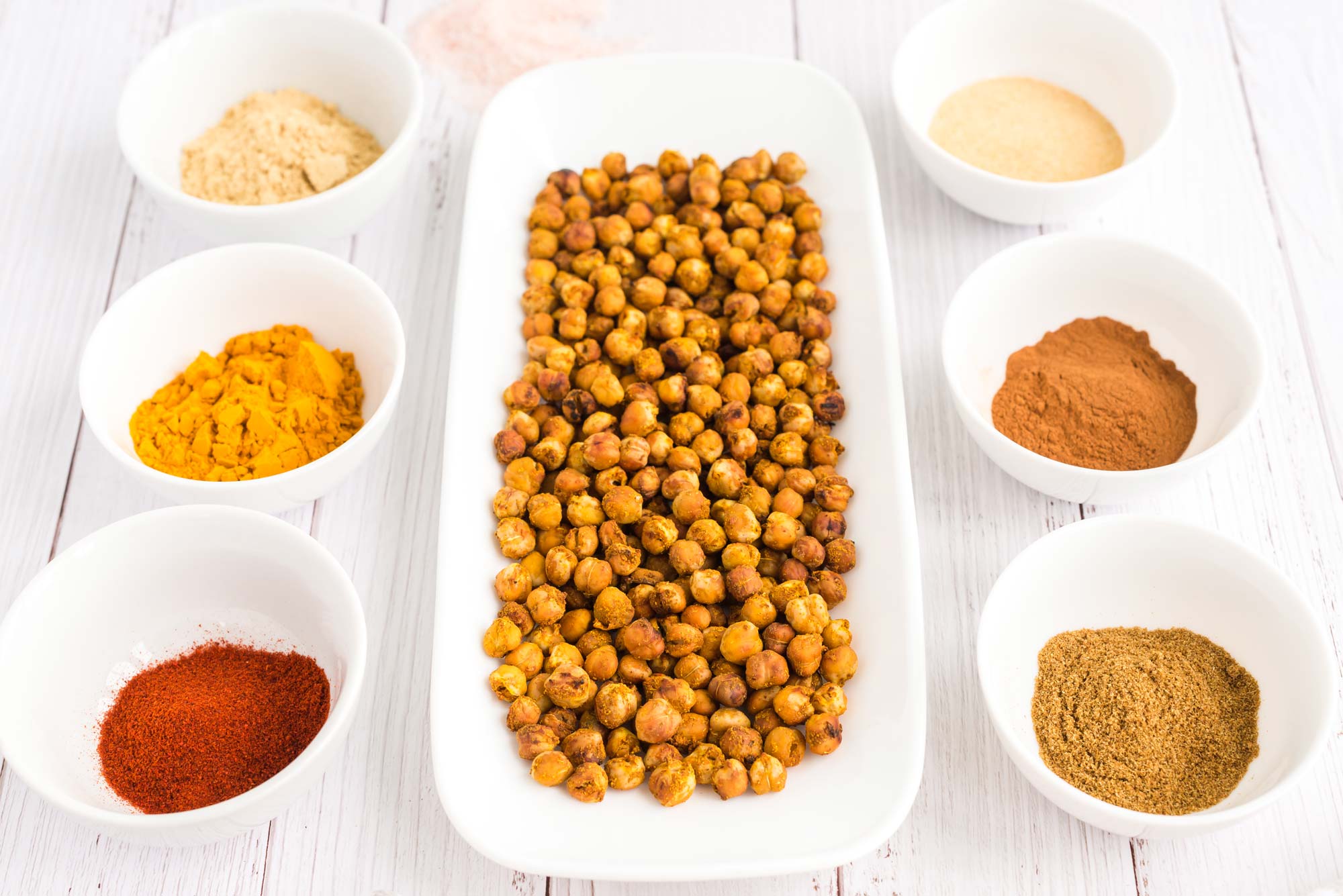 moroccan baked chickpeas in serving dish with spices