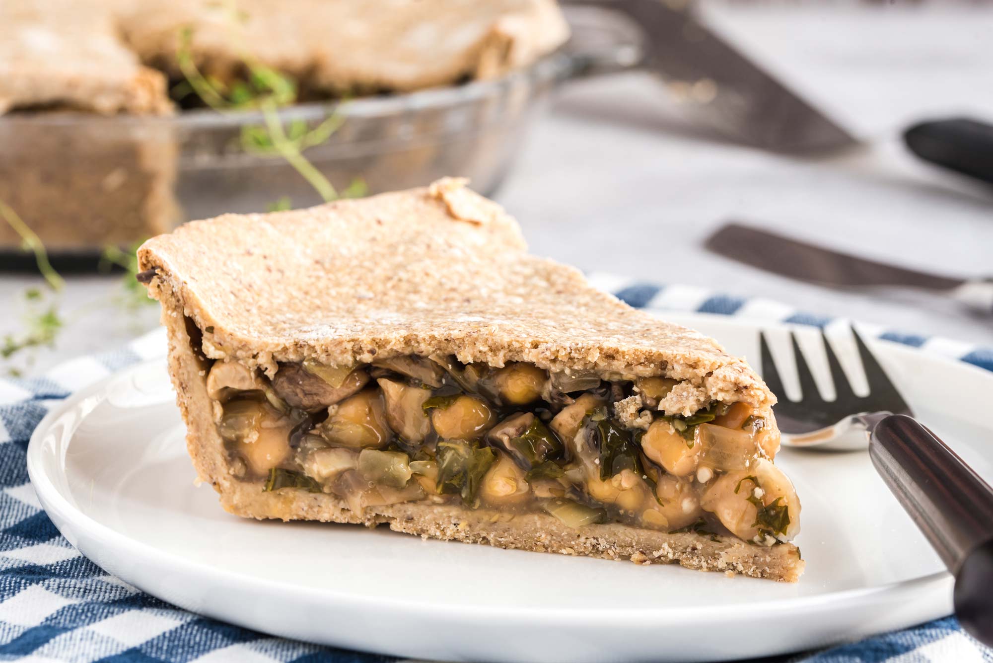 mushroom and kale pot pie slice on plate - healthy pie recipes
