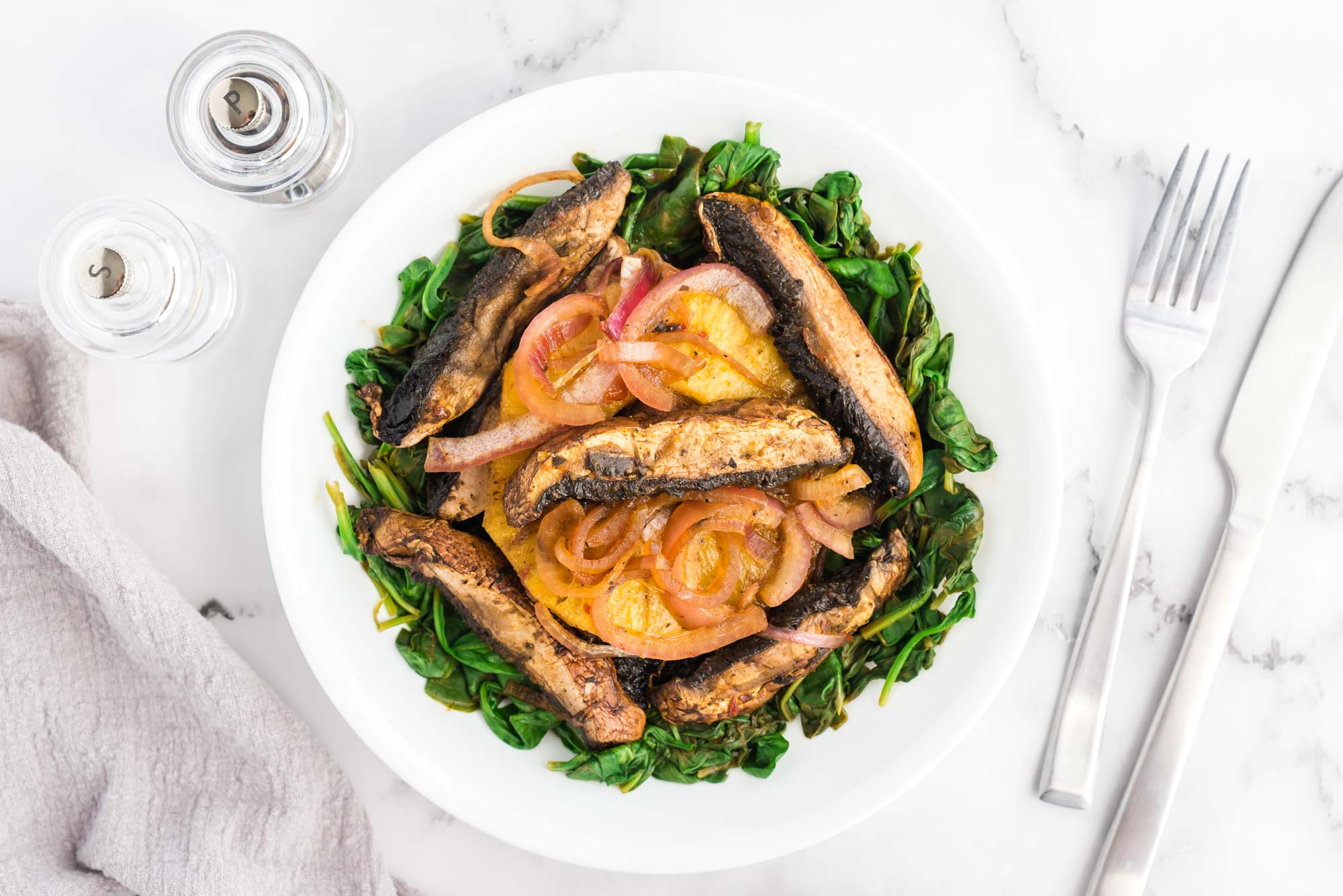 portobello mushroom strips on greens