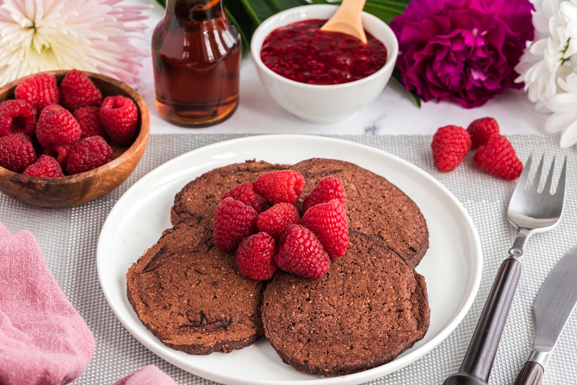 red velvet pancakes with fruit on a plate