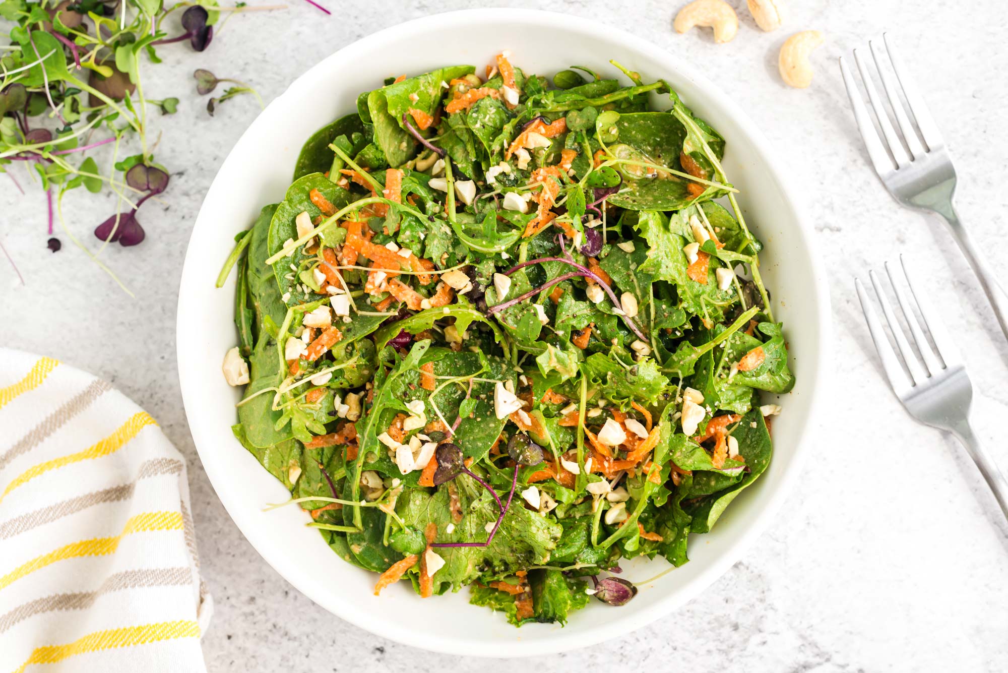 ginger miso sprout and carrot salad on plate