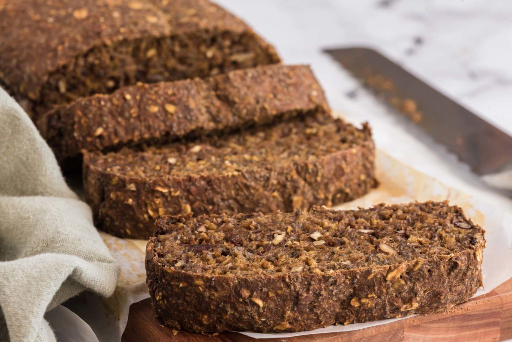 sweet and nutty teff gluten-free bread slices on cutting board