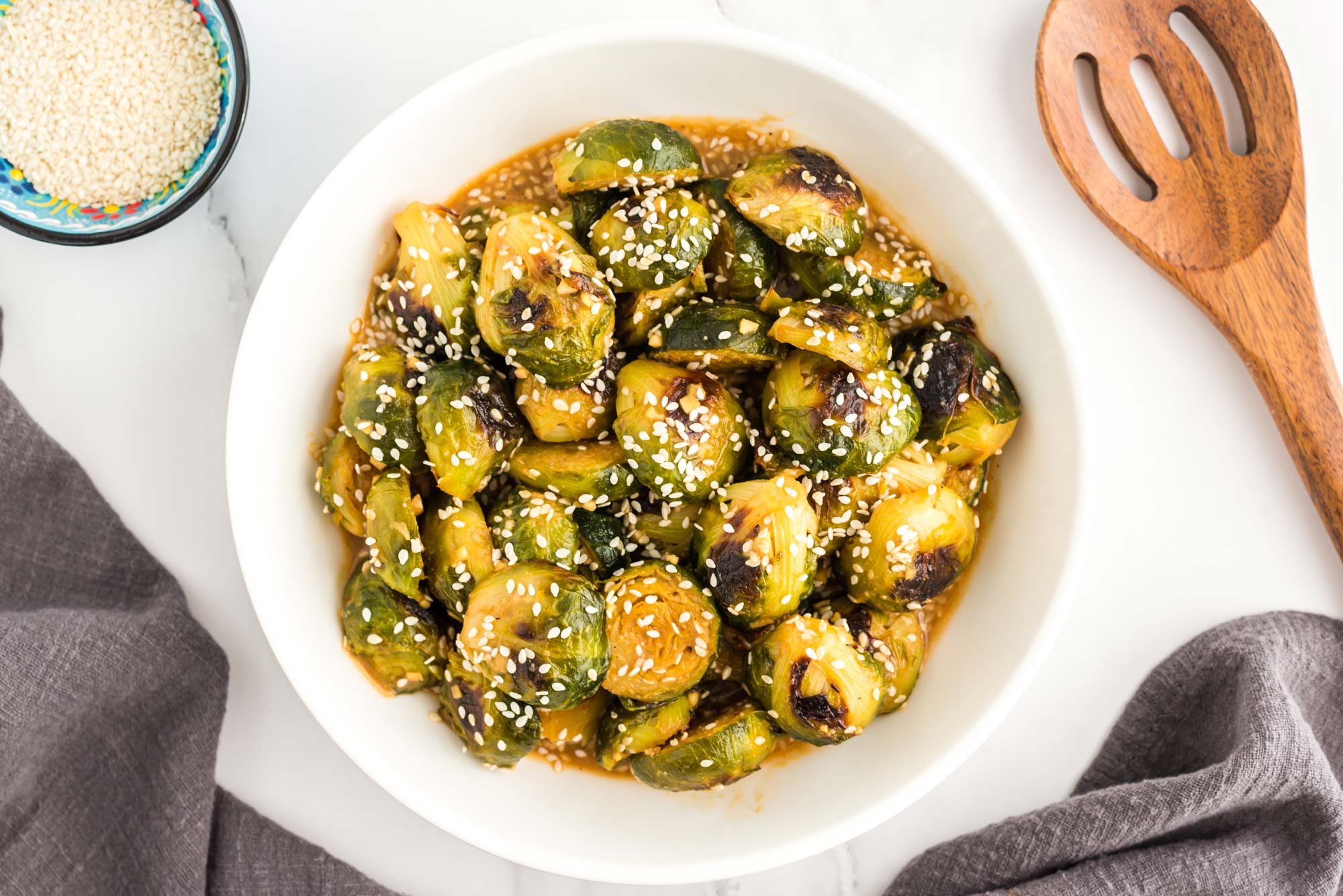 tangy tahini brussels sprouts in bowl