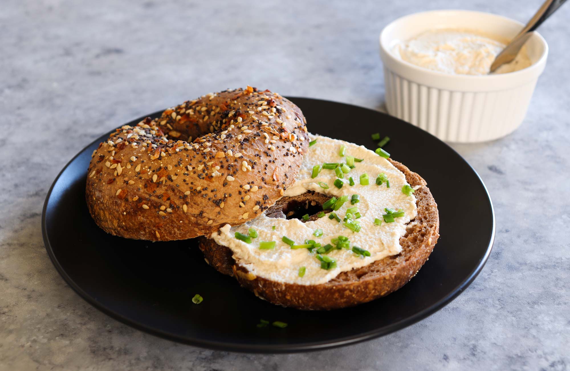 vegan cream cheese on whole grain bagel