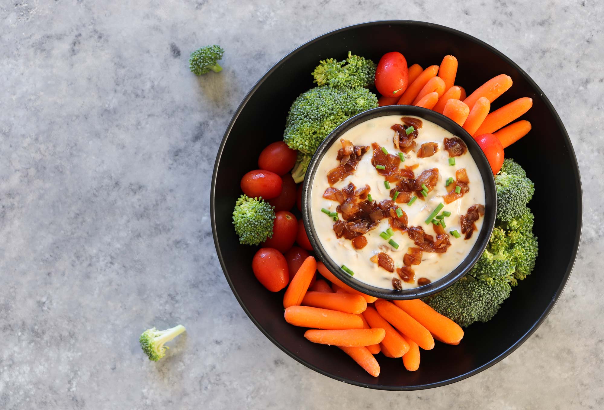 vegan onion dip displayed with cut veggies