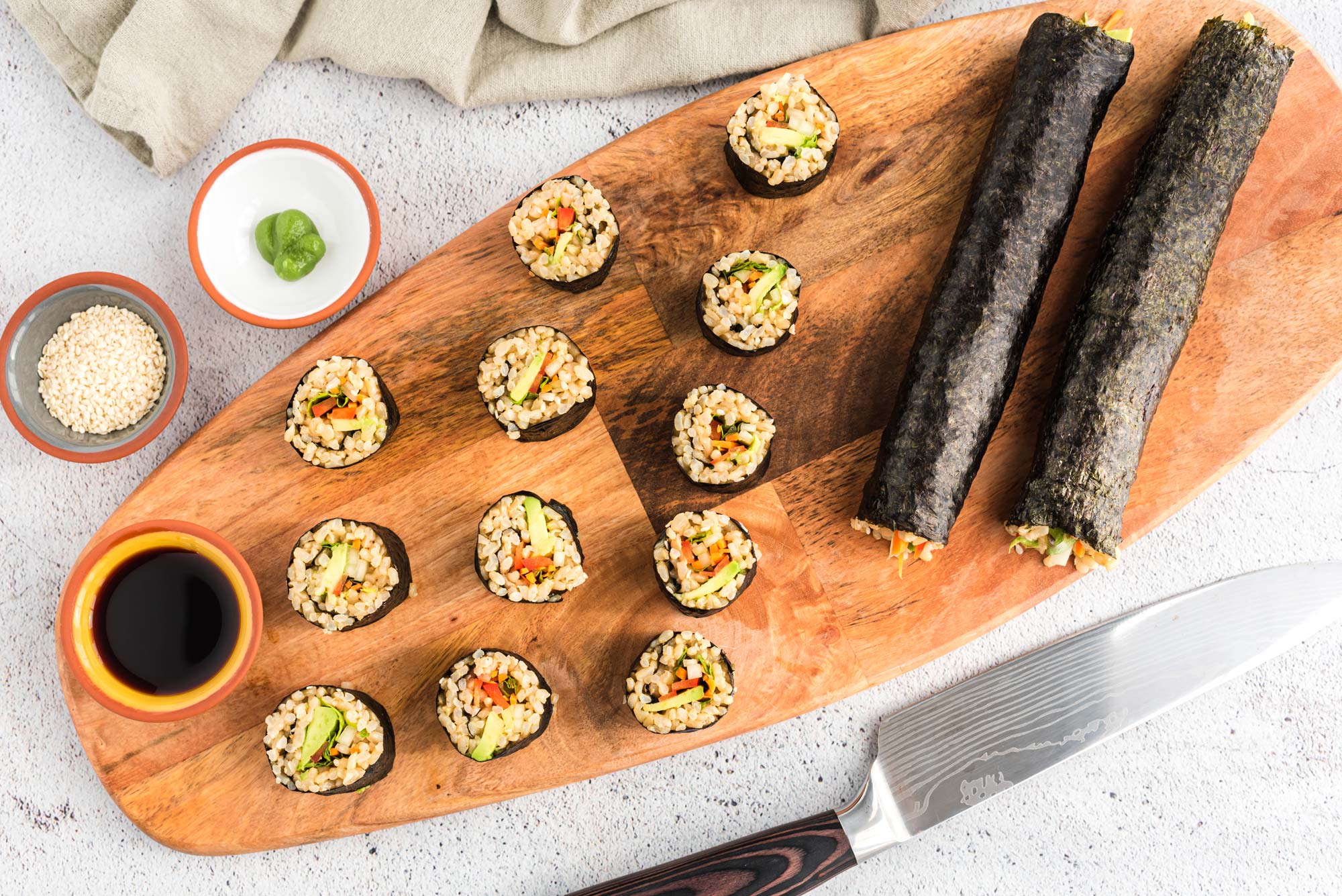 veggie nori rolls on cutting board